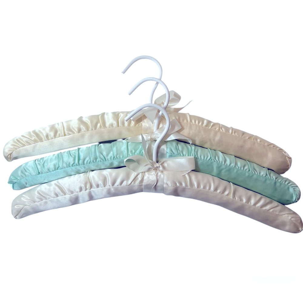 Three Luxurious Padded Satin Hangers-2 Cream and 1 Soft Blue Hanger.